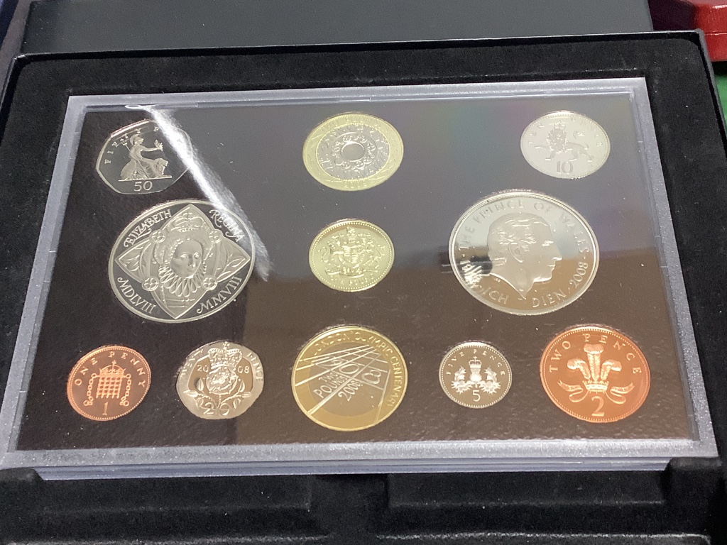 Three UK proof coin sets: Royal Shield Arms 2008, and 2005 and 2008 year sets, other UNC coins and 18th century and later world coins